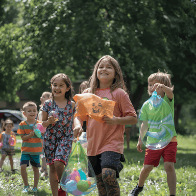 Kids with reusable water balloons summer